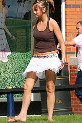 Young babe flashing - wind blowing up skirt